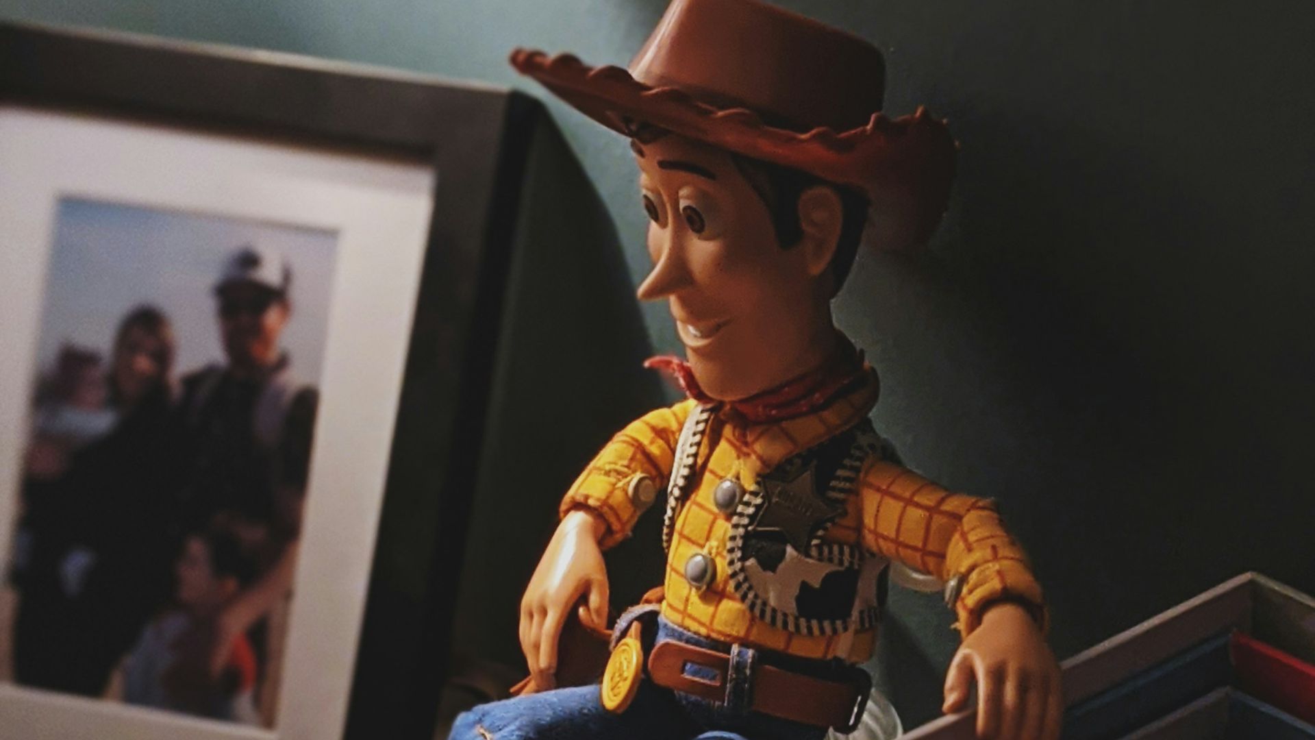 boy in cowboy costume standing on wooden box