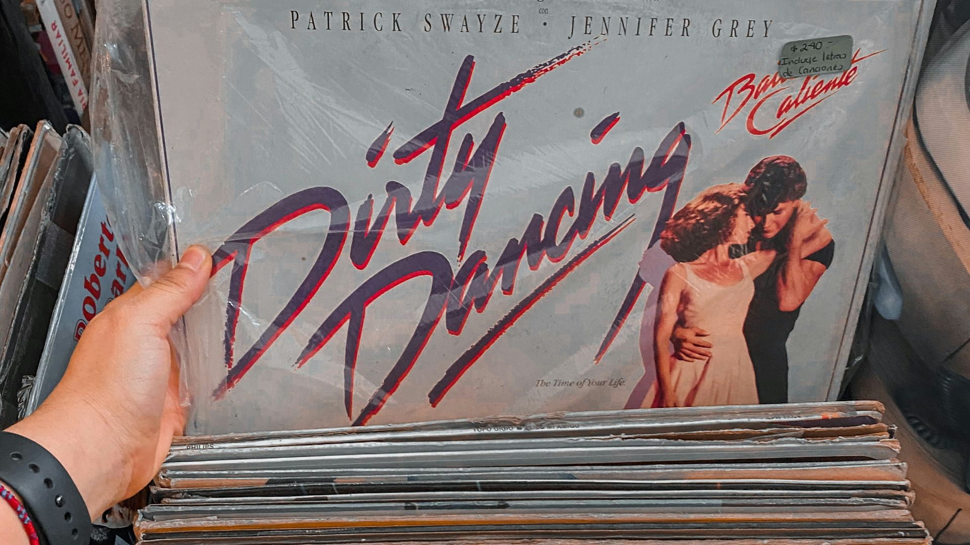 person holding white and black vinyl record