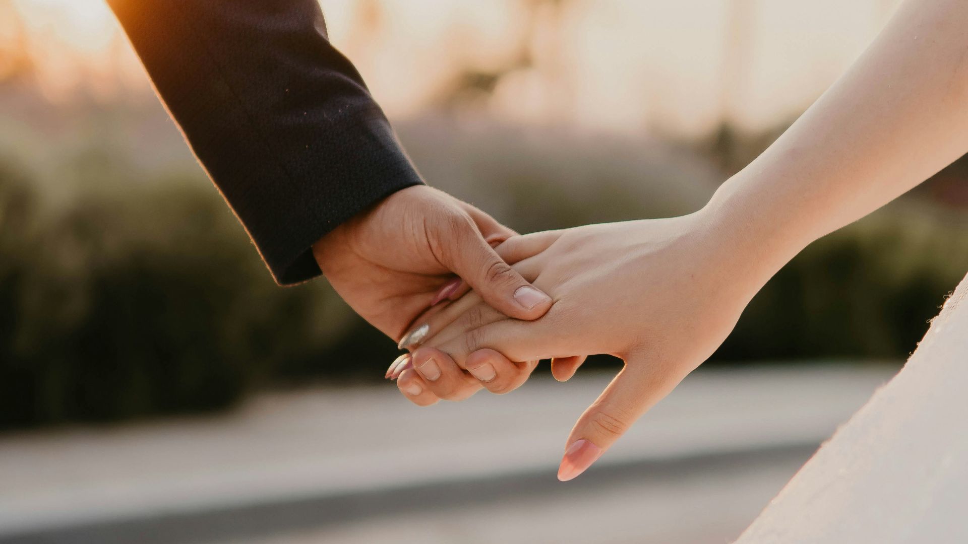 man and woman hands holding