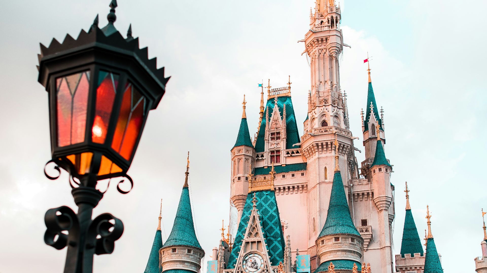 white and blue castle under cloudy sky during daytime