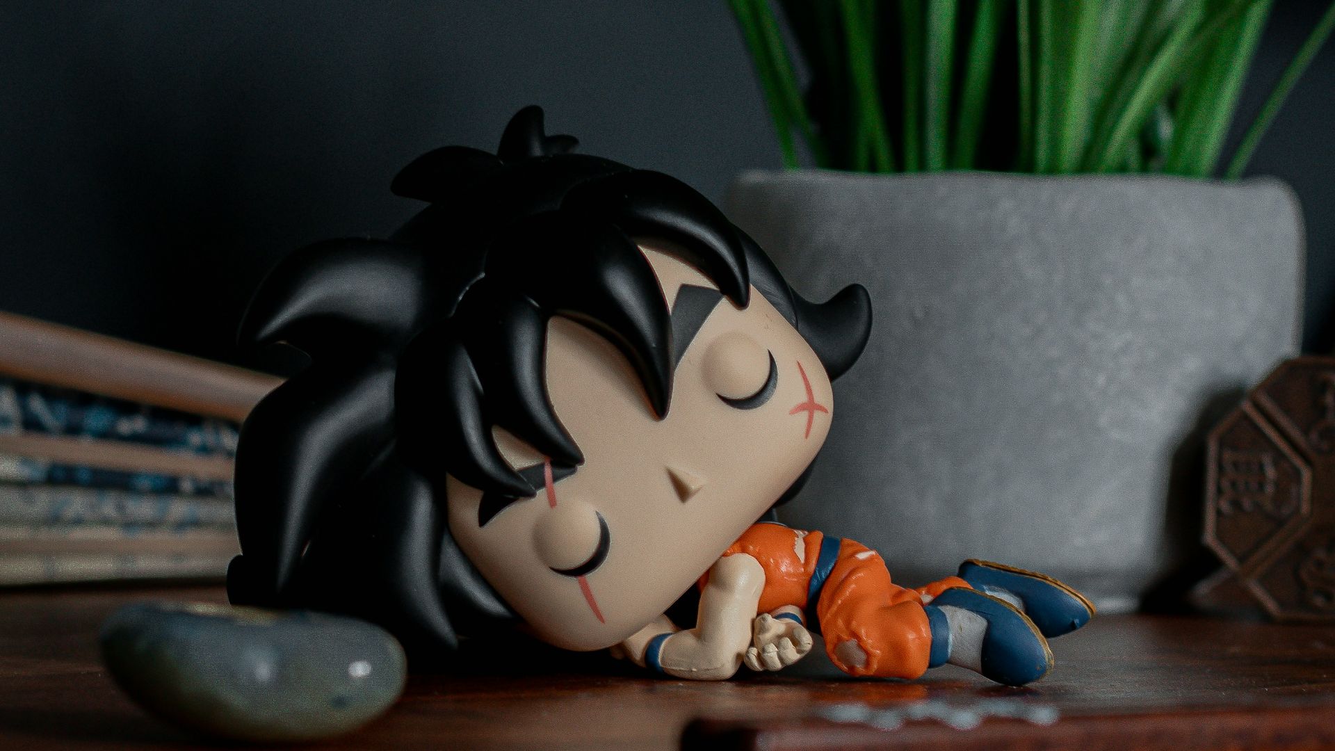 white and black panda ceramic figurine on brown wooden table