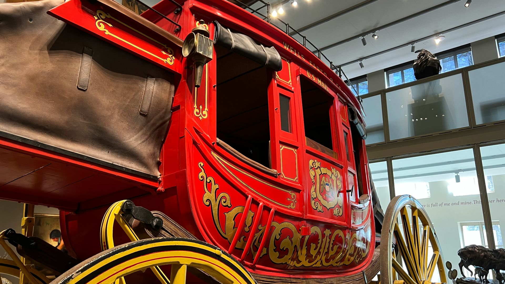 a large red and yellow horse drawn carriage
