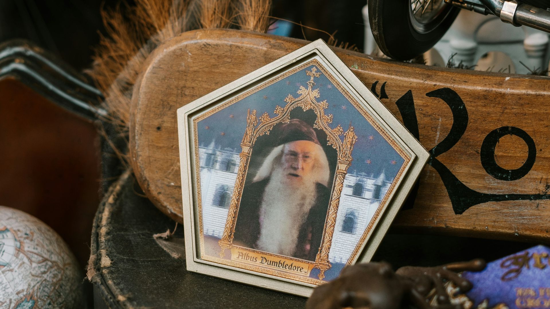 black and silver dumbbell beside brown wooden picture frame