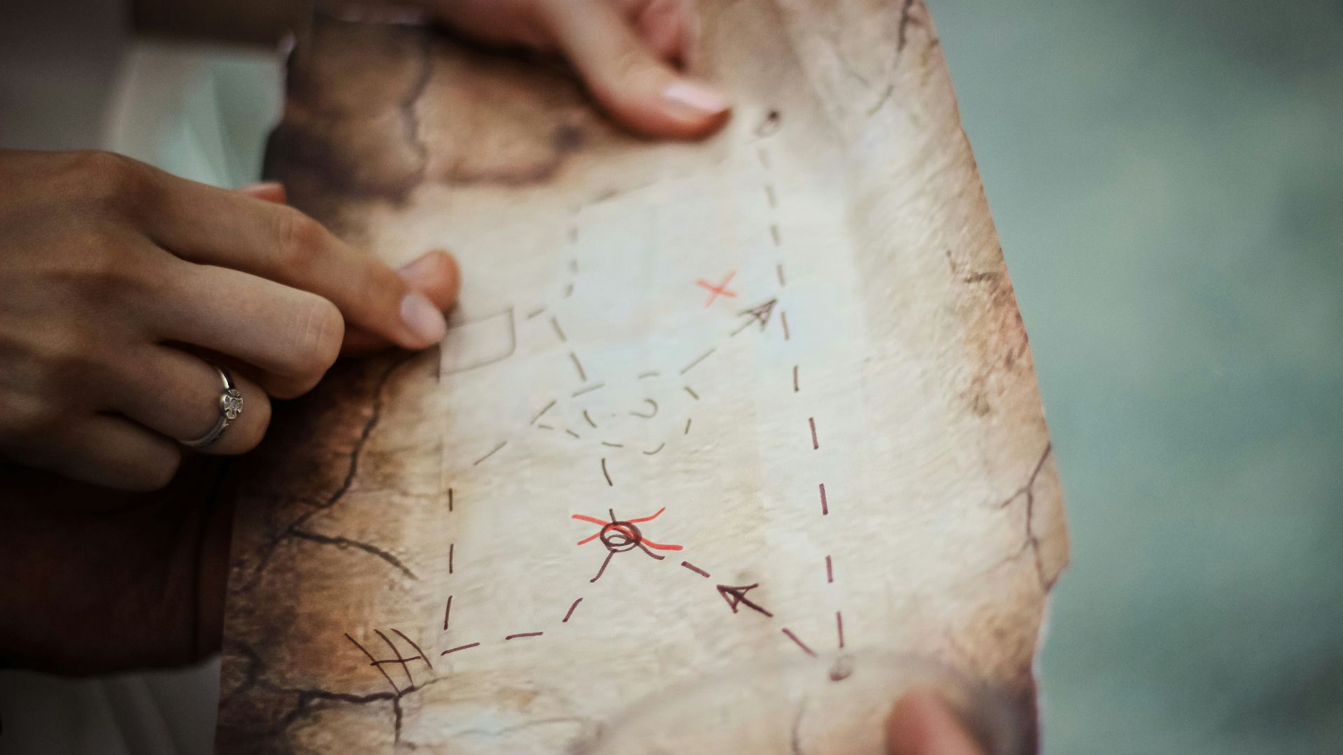 person holding brown map