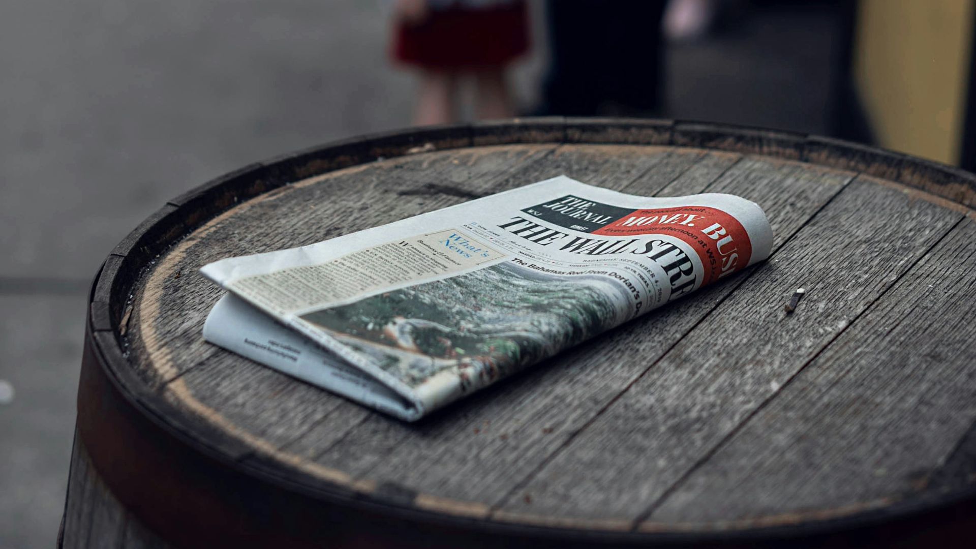 newspaper on wooden barrel