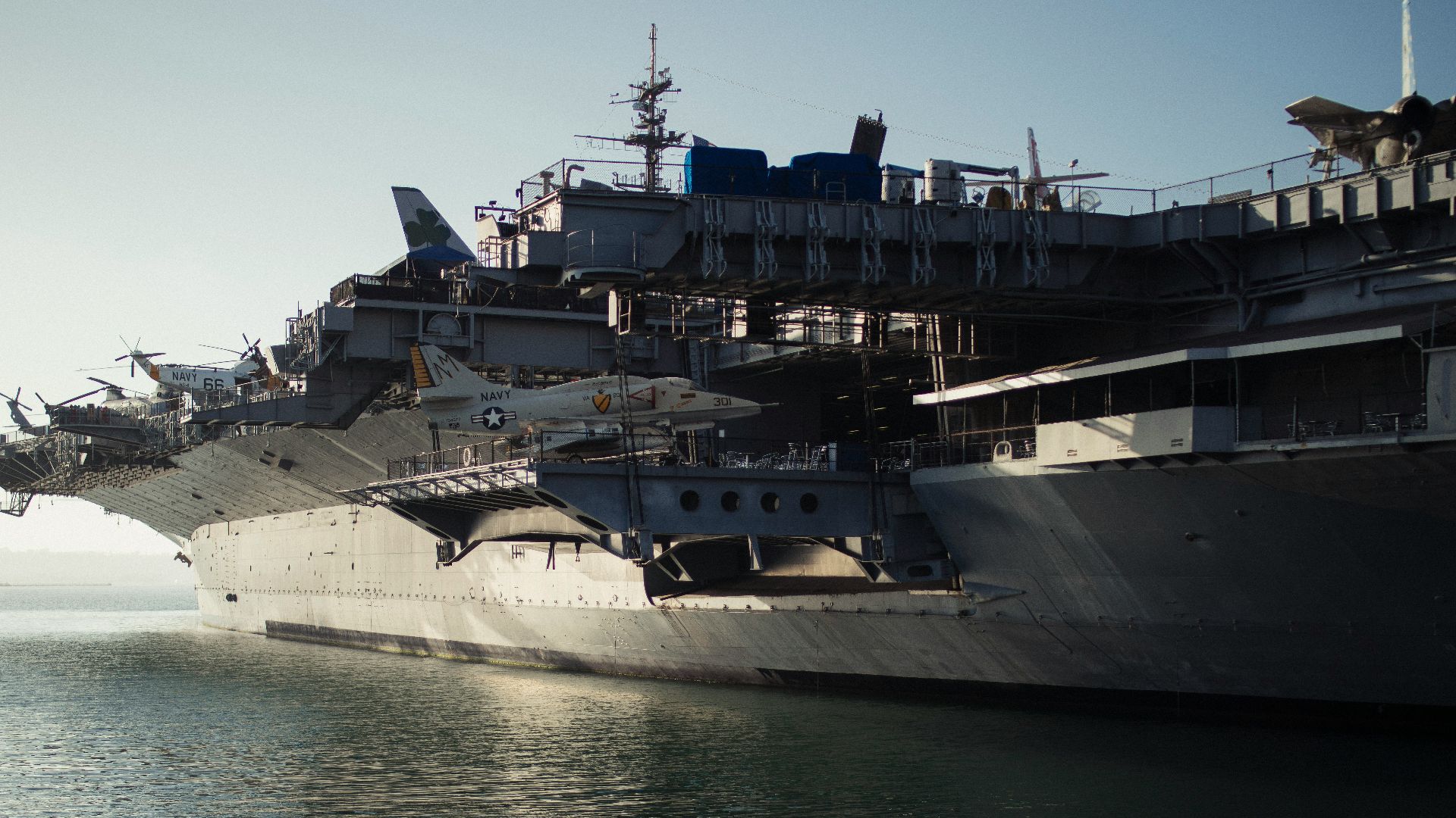 gray warship on body of water