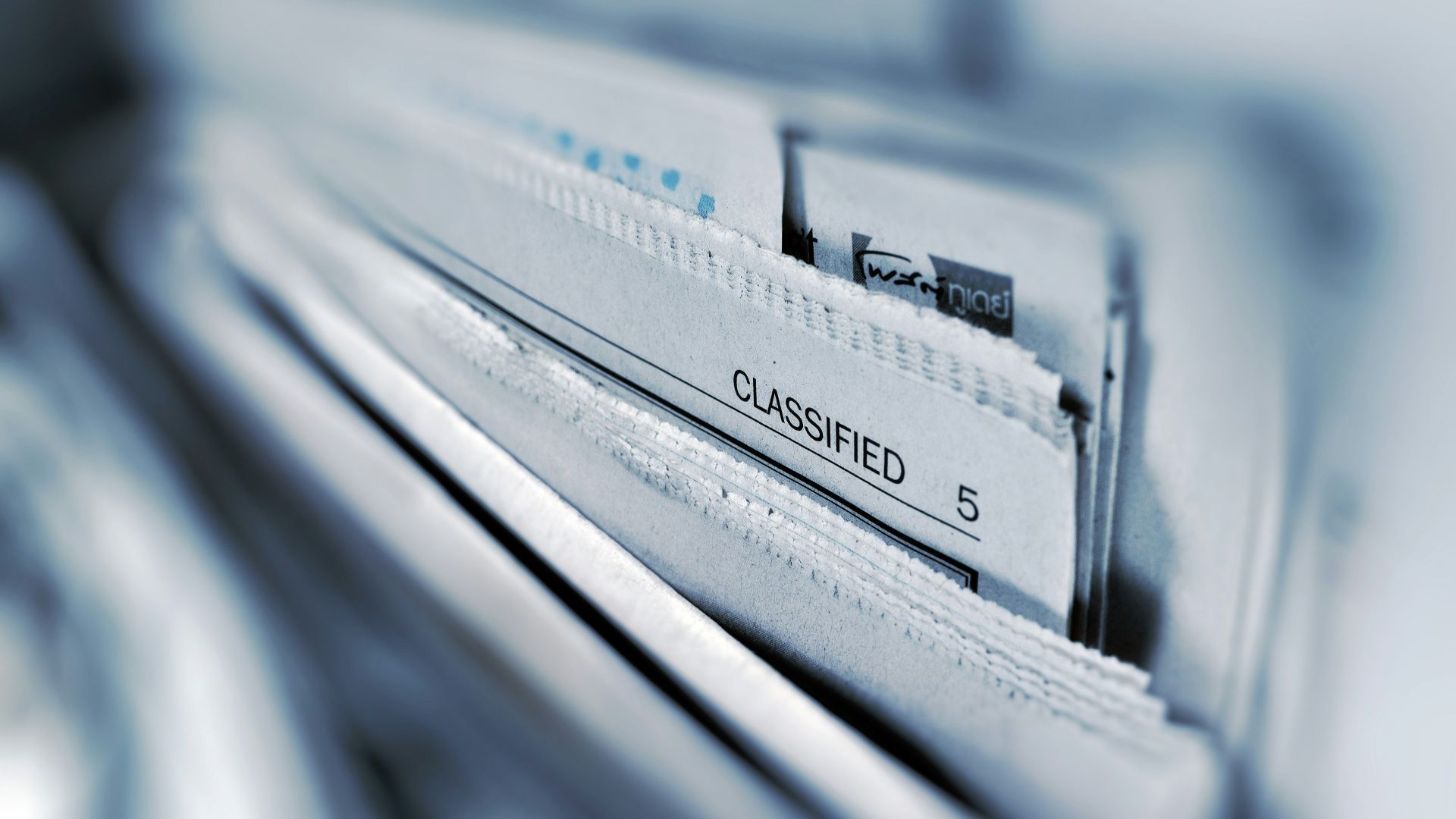 Classified page 5 newspaper selective focus photography