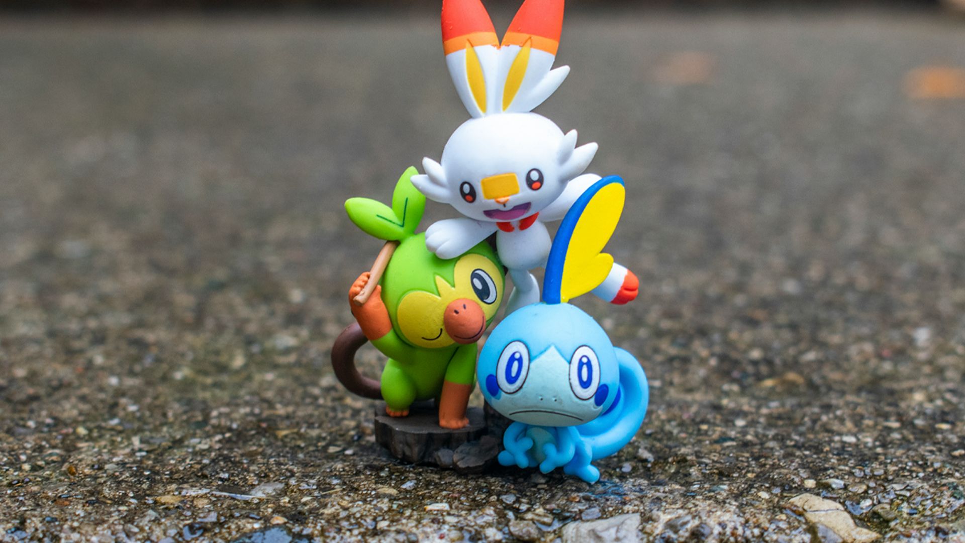 a group of pokemon figurines sitting on top of a rock
