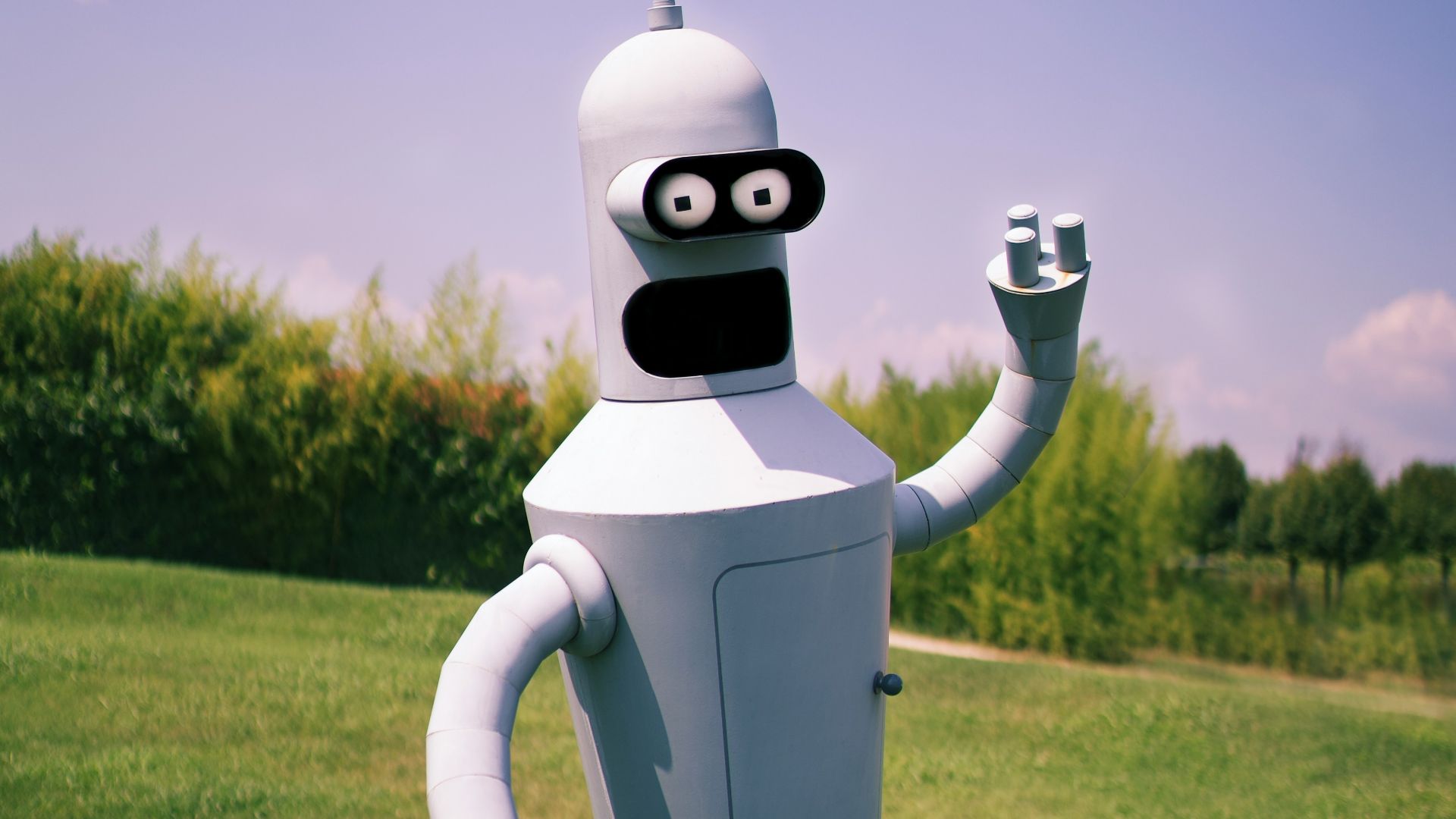 white robot on green grass field during daytime