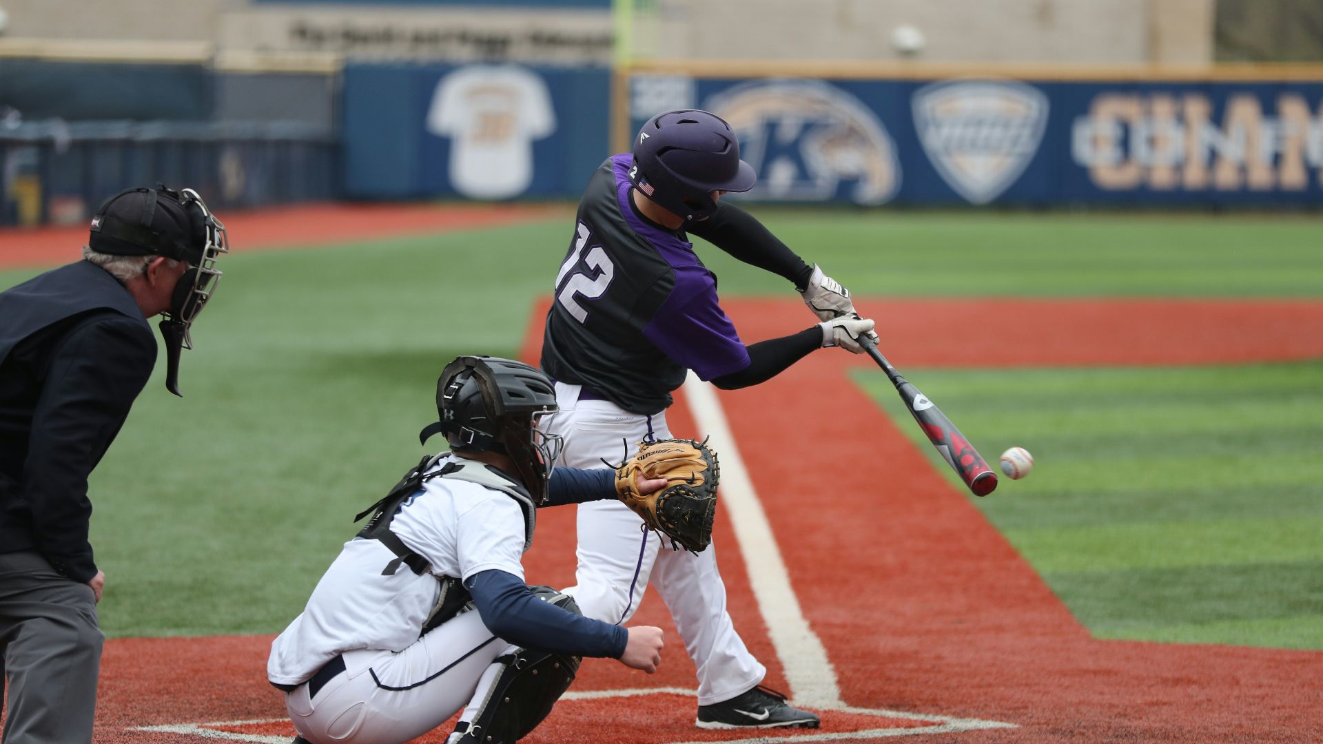 baseball player swinging bat