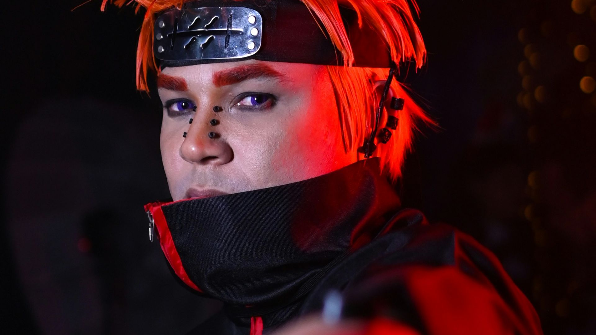 a woman with red hair pointing at something