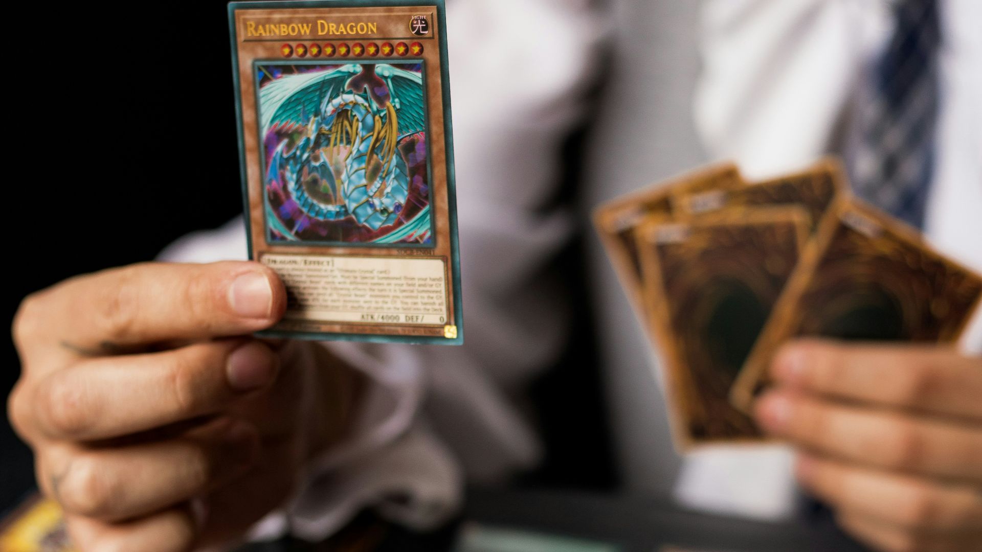 a man holding a deck of cards in his hands