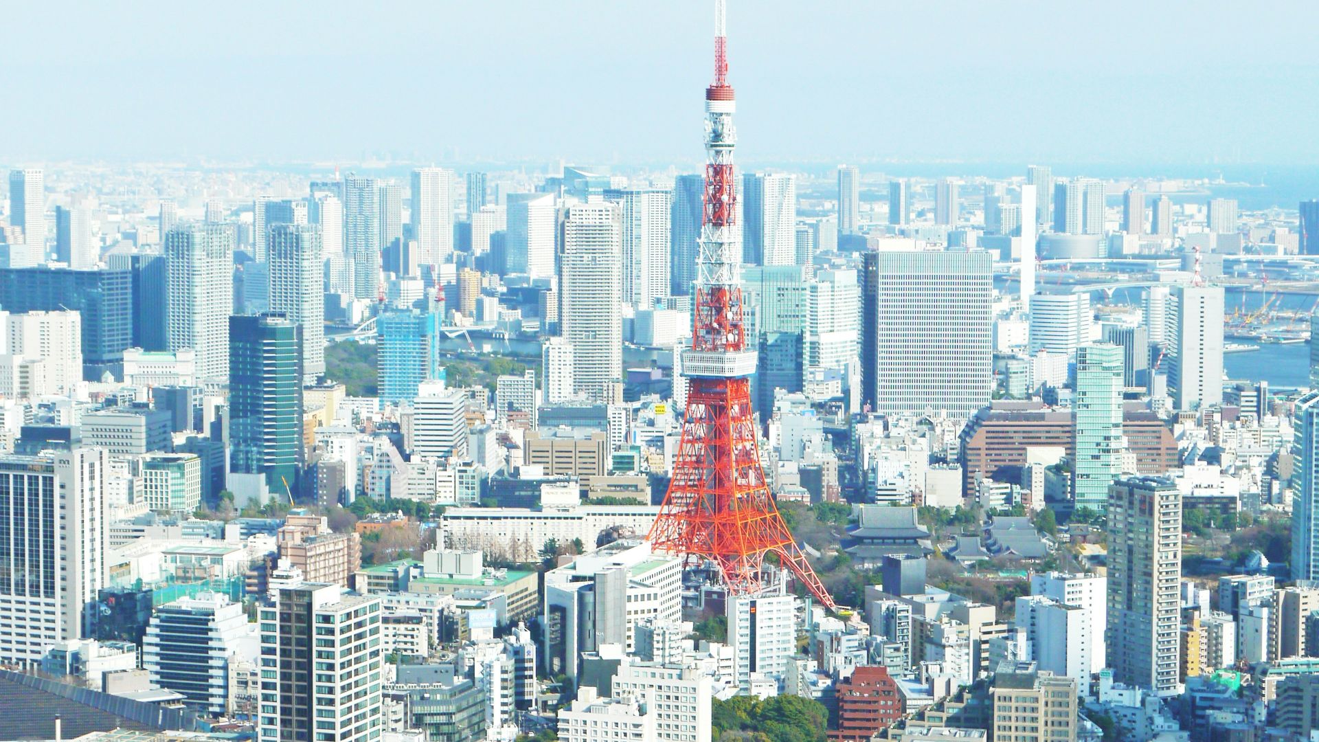 aerial photography of red tower surrounded by buildings during daytime