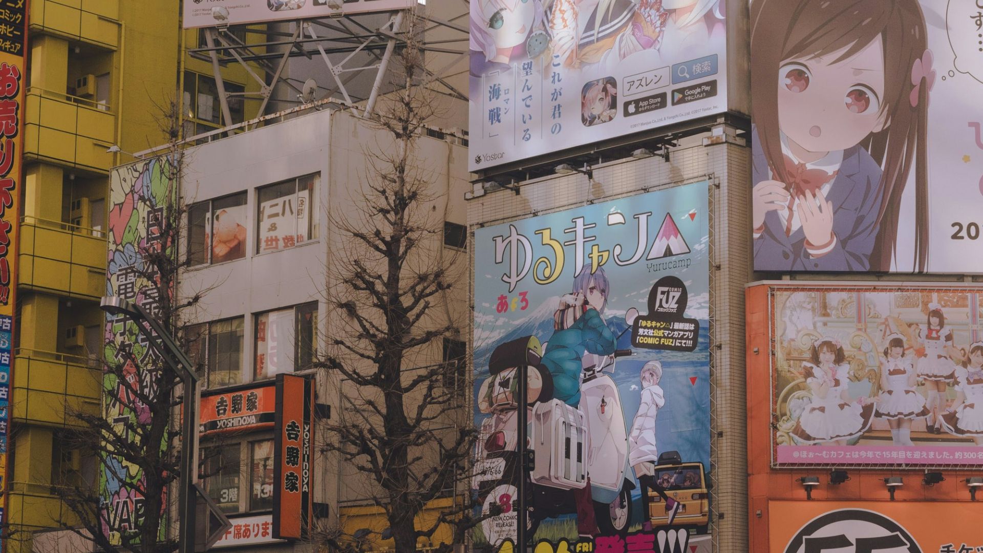 white and black cars parked beside brown building during daytime