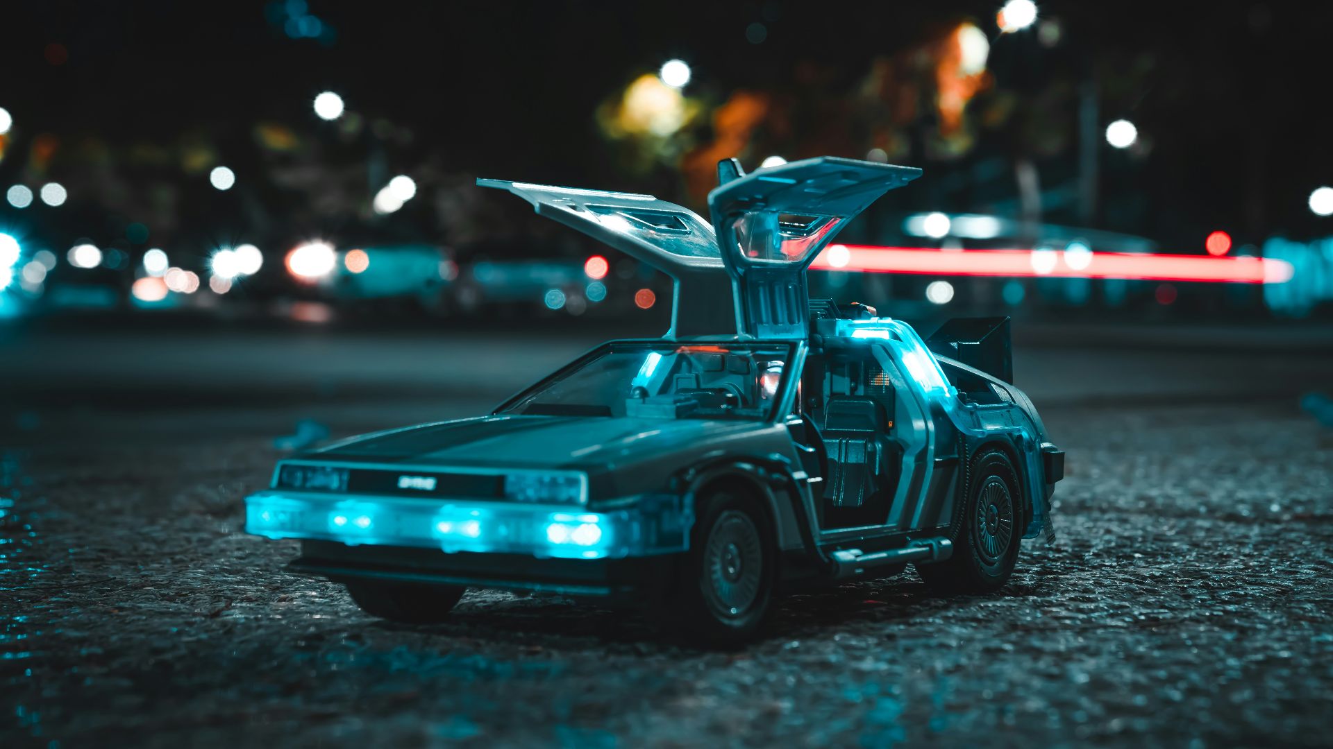 a toy car with its hood open sitting on the ground