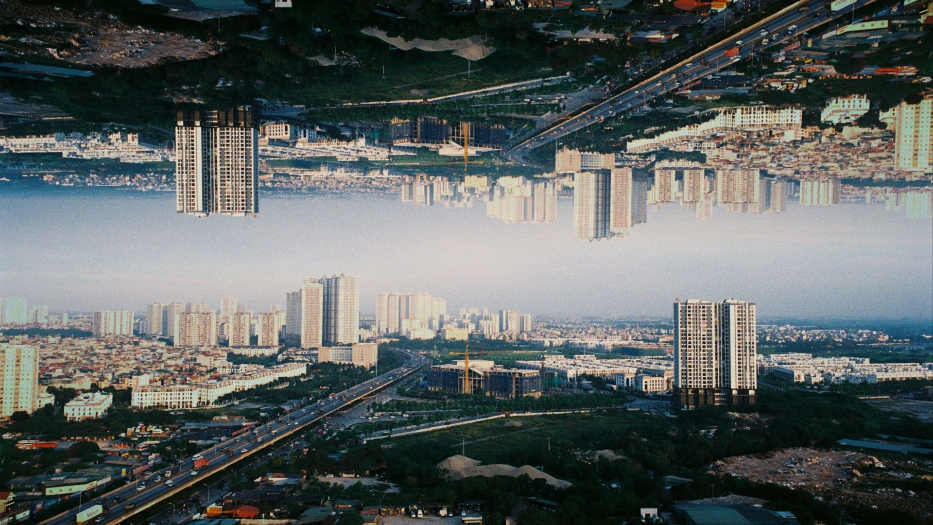 an aerial view of a city with tall buildings