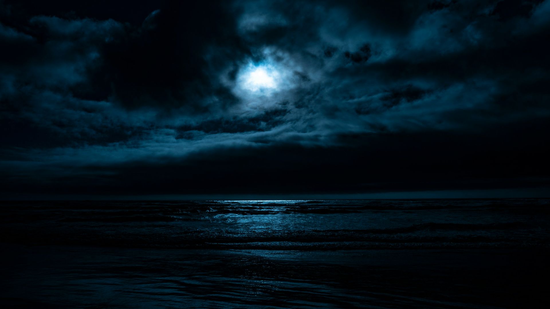 body of water under full moon