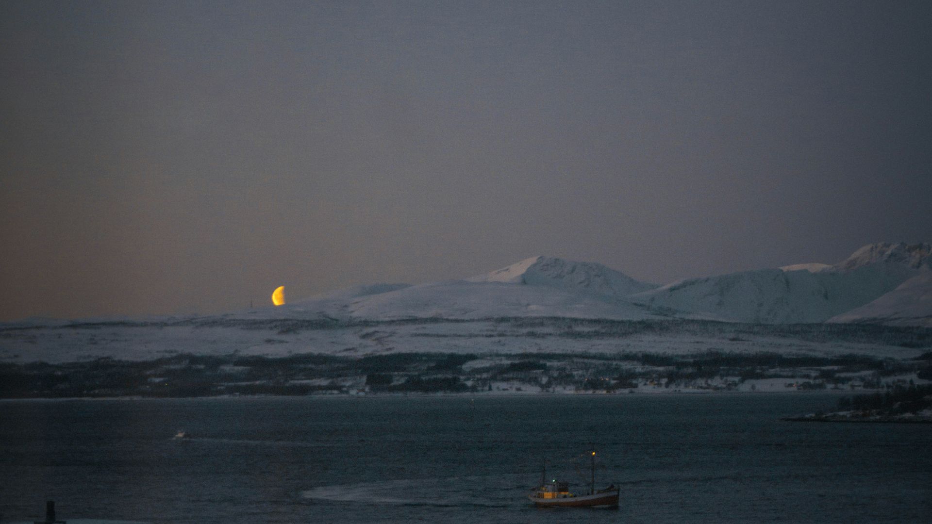 a boat floating on top of a body of water