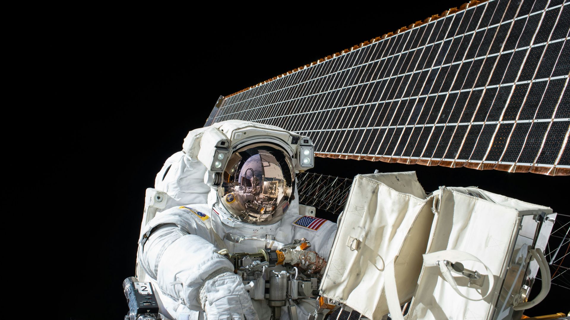 photography of Astronaut beside satellite