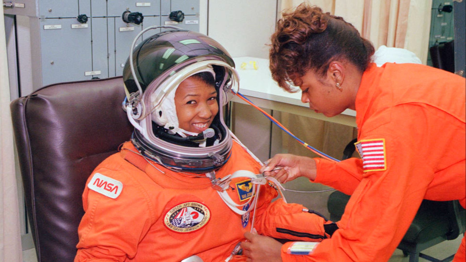 File:NASA astronaut Mae Jemison waits as her suit technician, Sharon McDougle, performs a unpressurized and pressurized leak check on her spacesuit.jpg