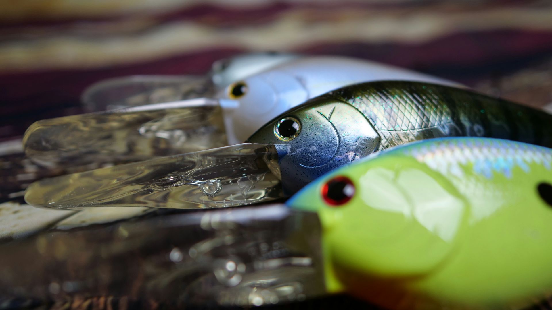 a couple of fish sitting on top of a wooden table