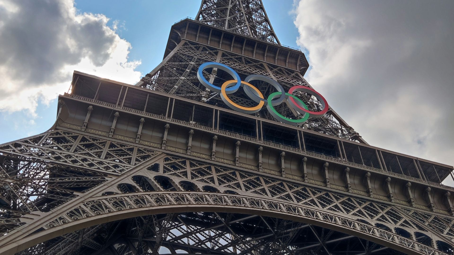 The eiffel tower with the olympic logo on it