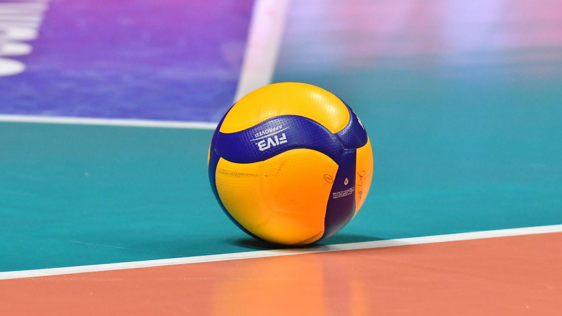 a yellow and blue ball on a pool table