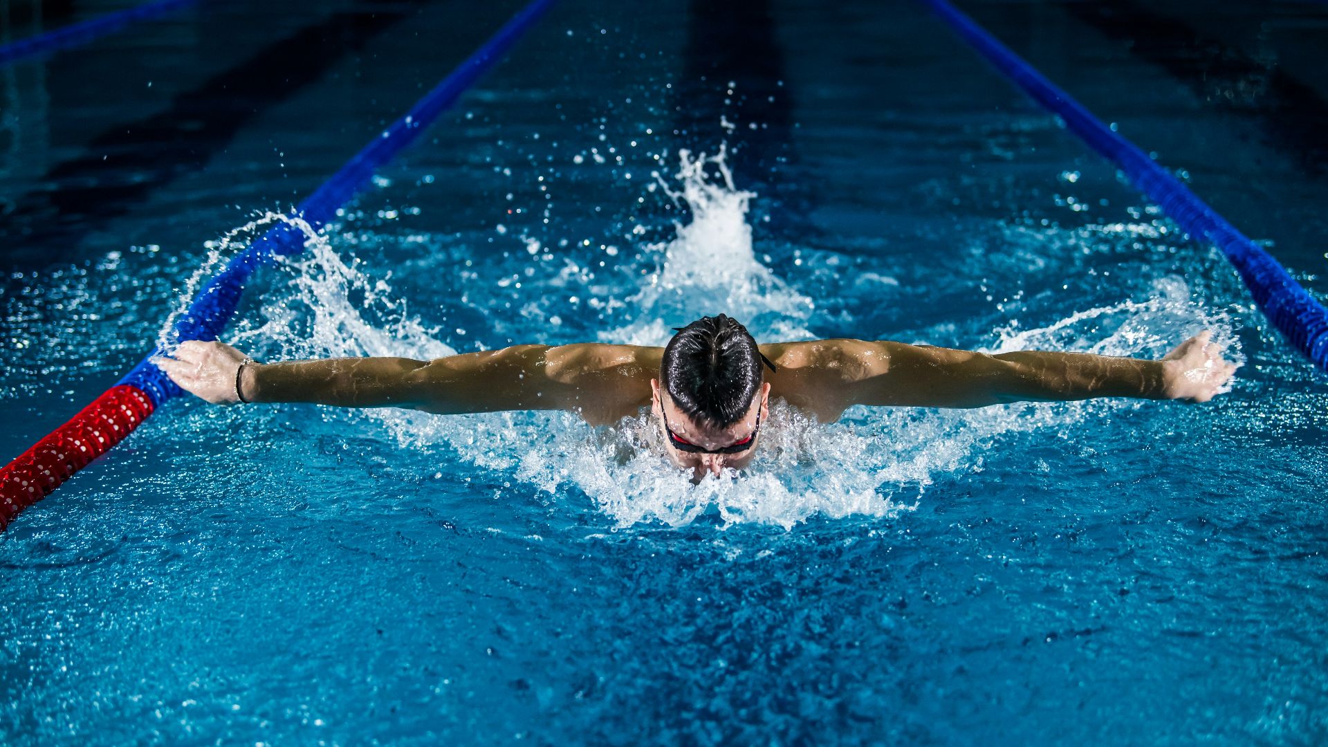 man doing butterfly stroke