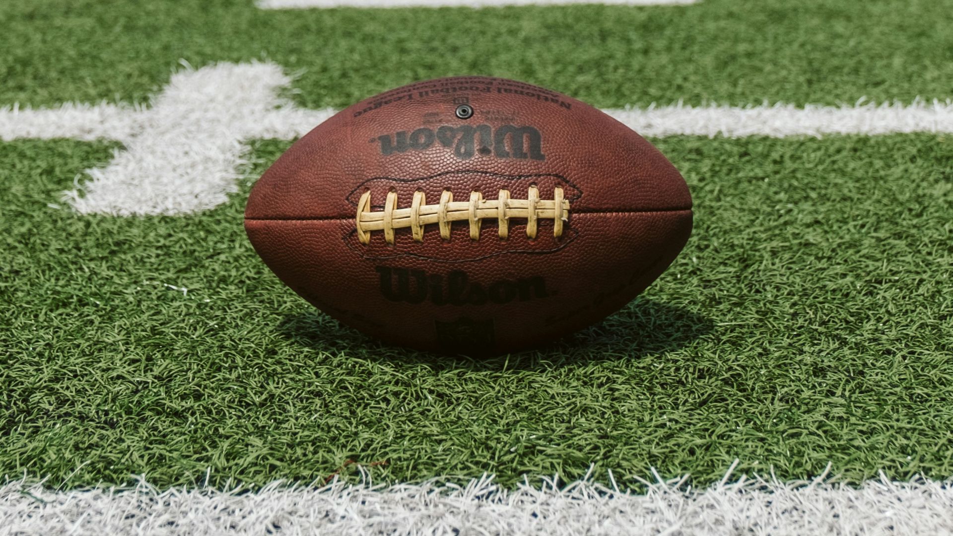 brown and black Wilson football