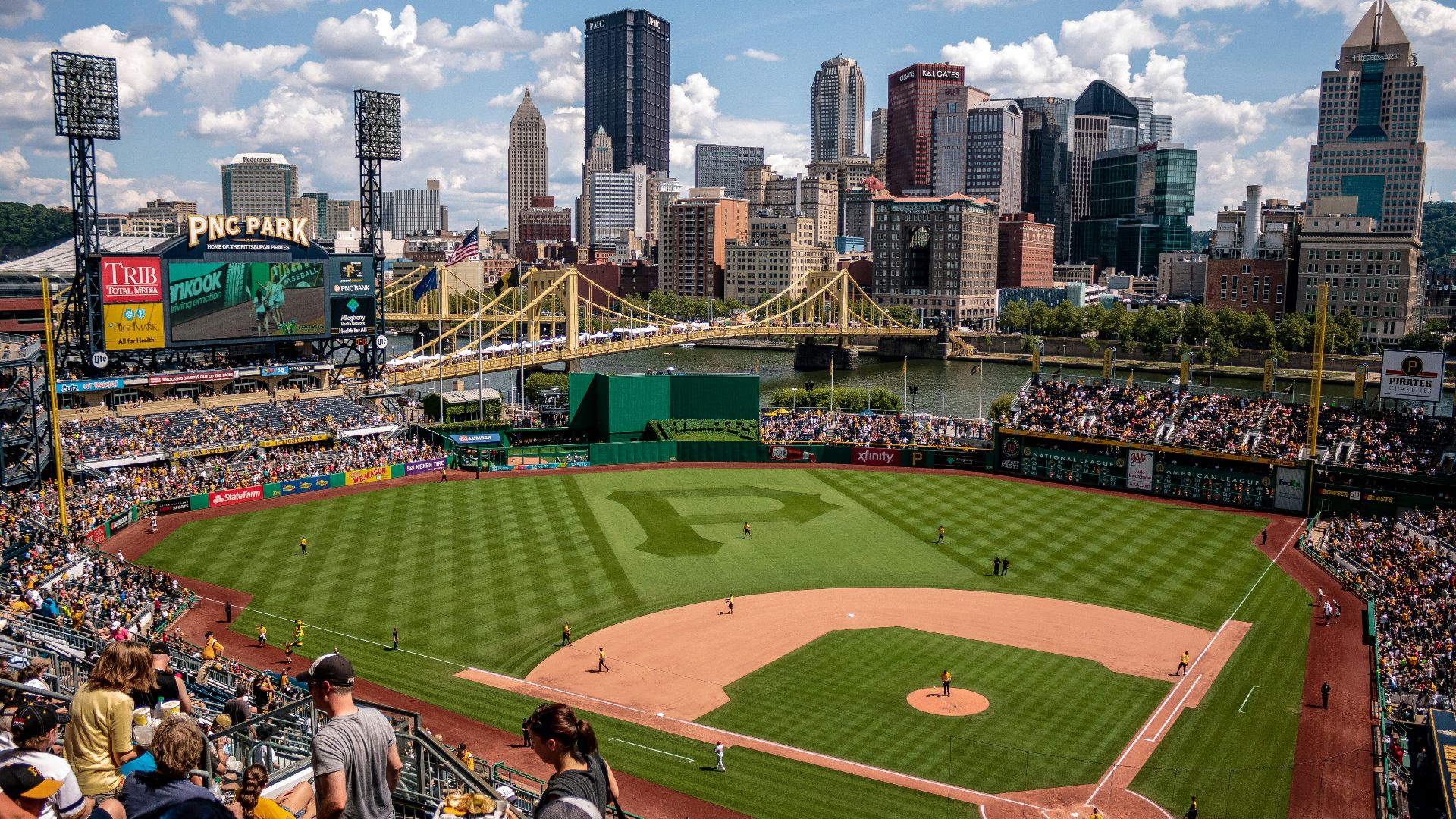 game at baseball court surrounded by fans