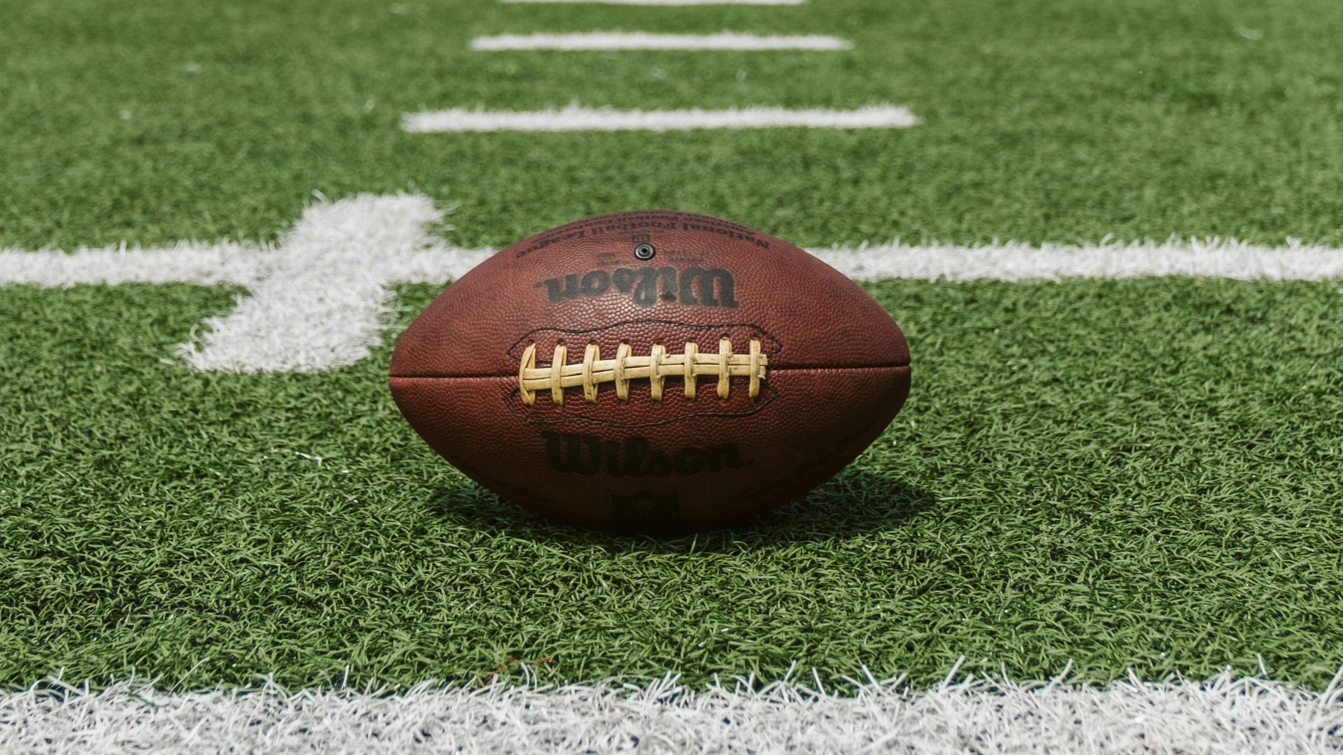 brown and black Wilson football