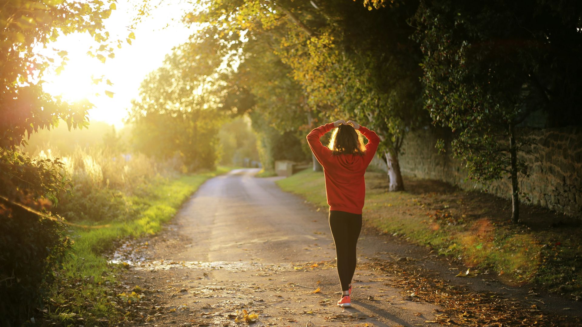woman walking on pathway during daytime