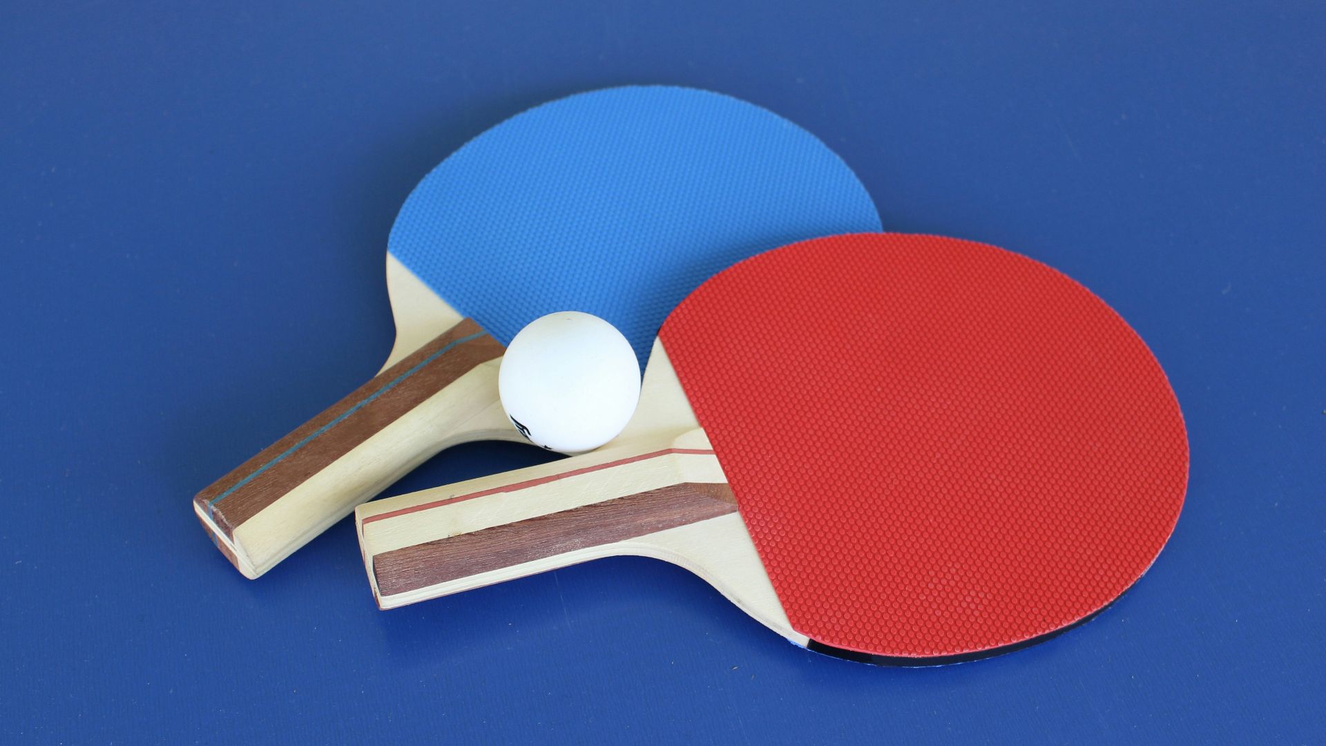 blue and white ball and white golf club