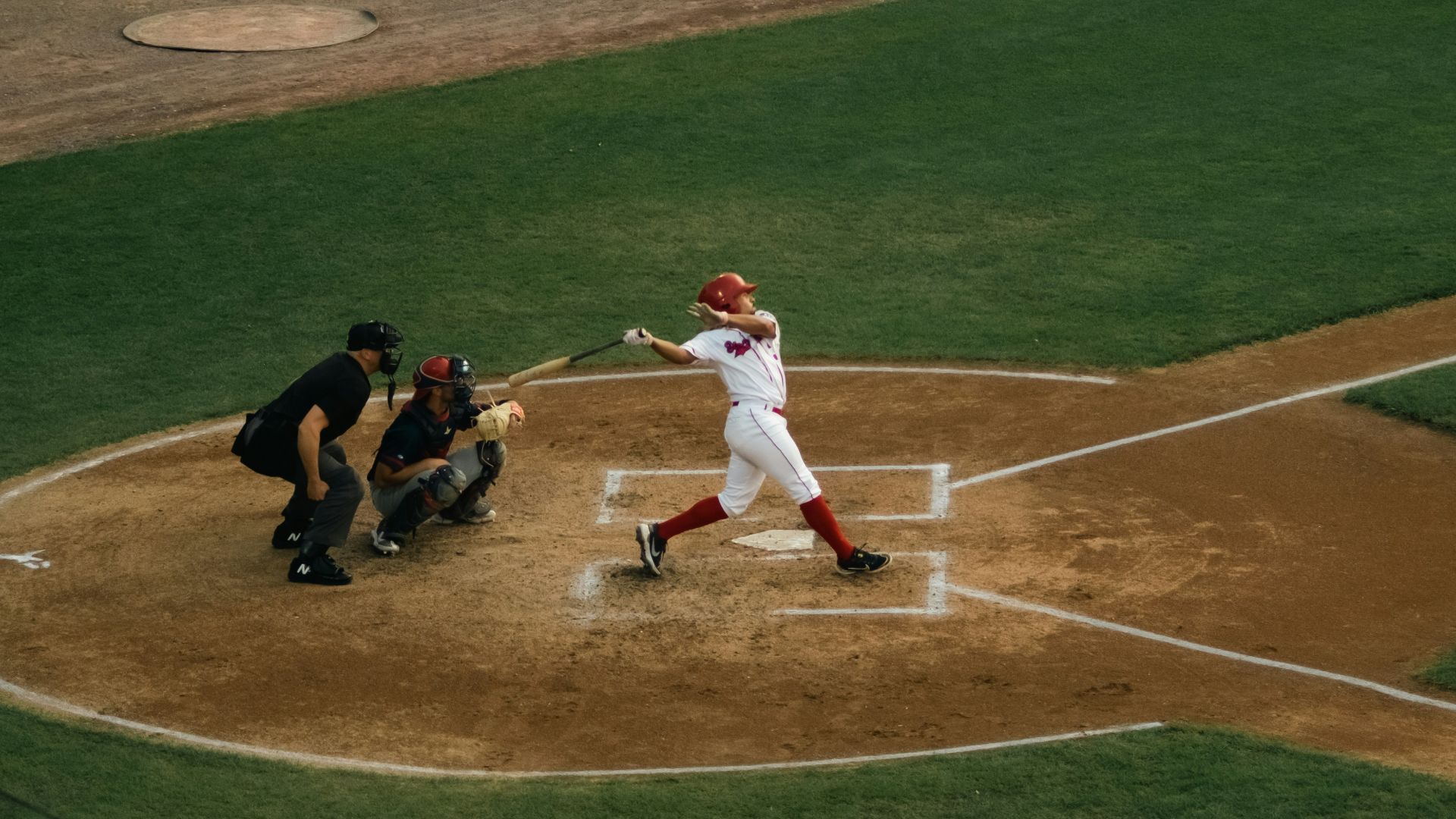 a baseball player swinging a bat