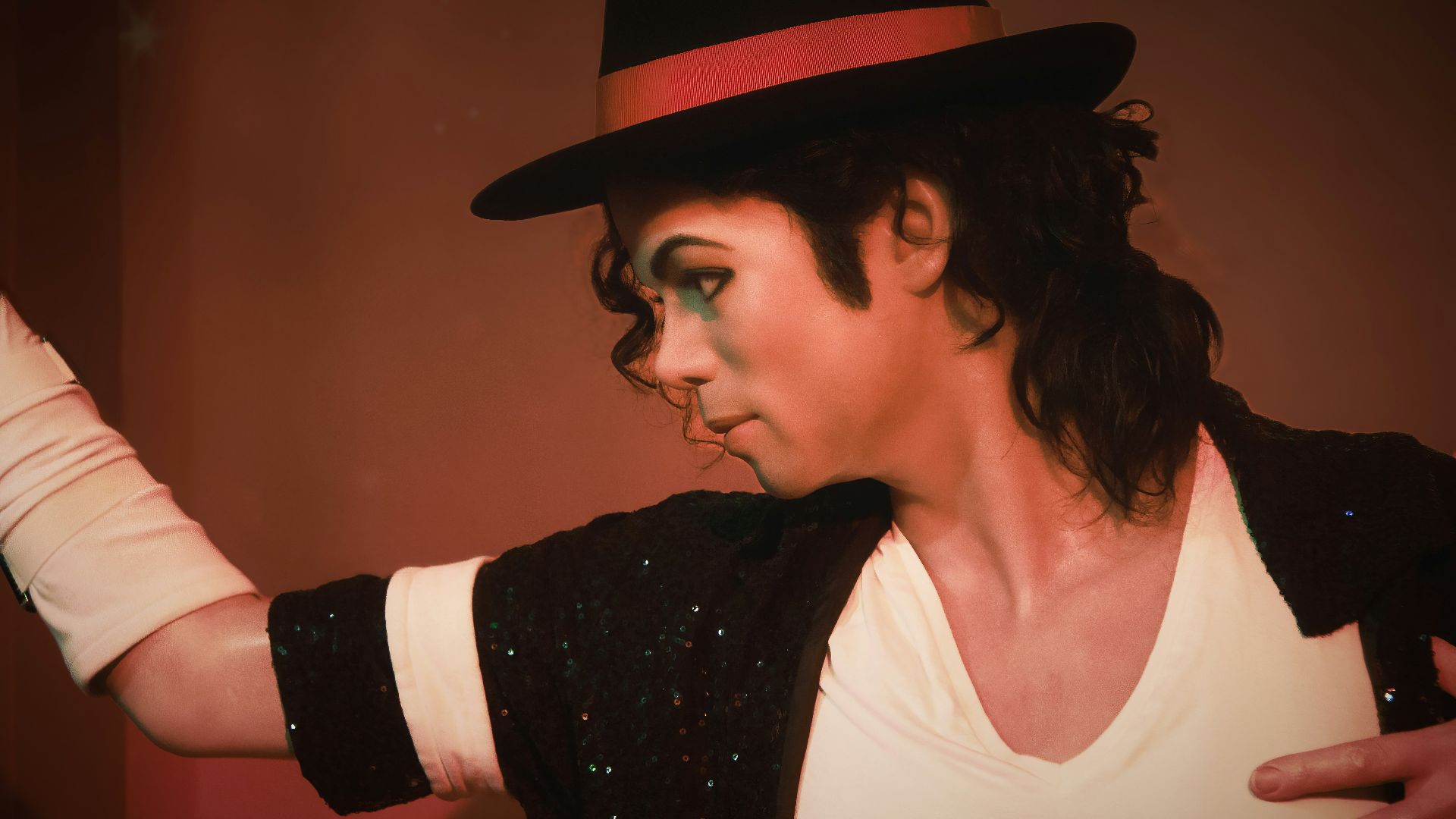 a man in a top hat and black jacket