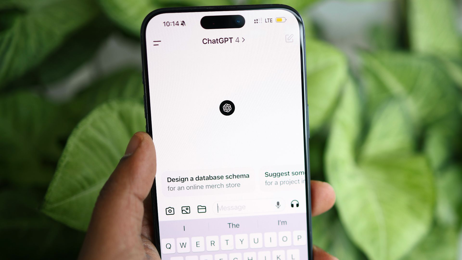 a person holding a cell phone in their hand