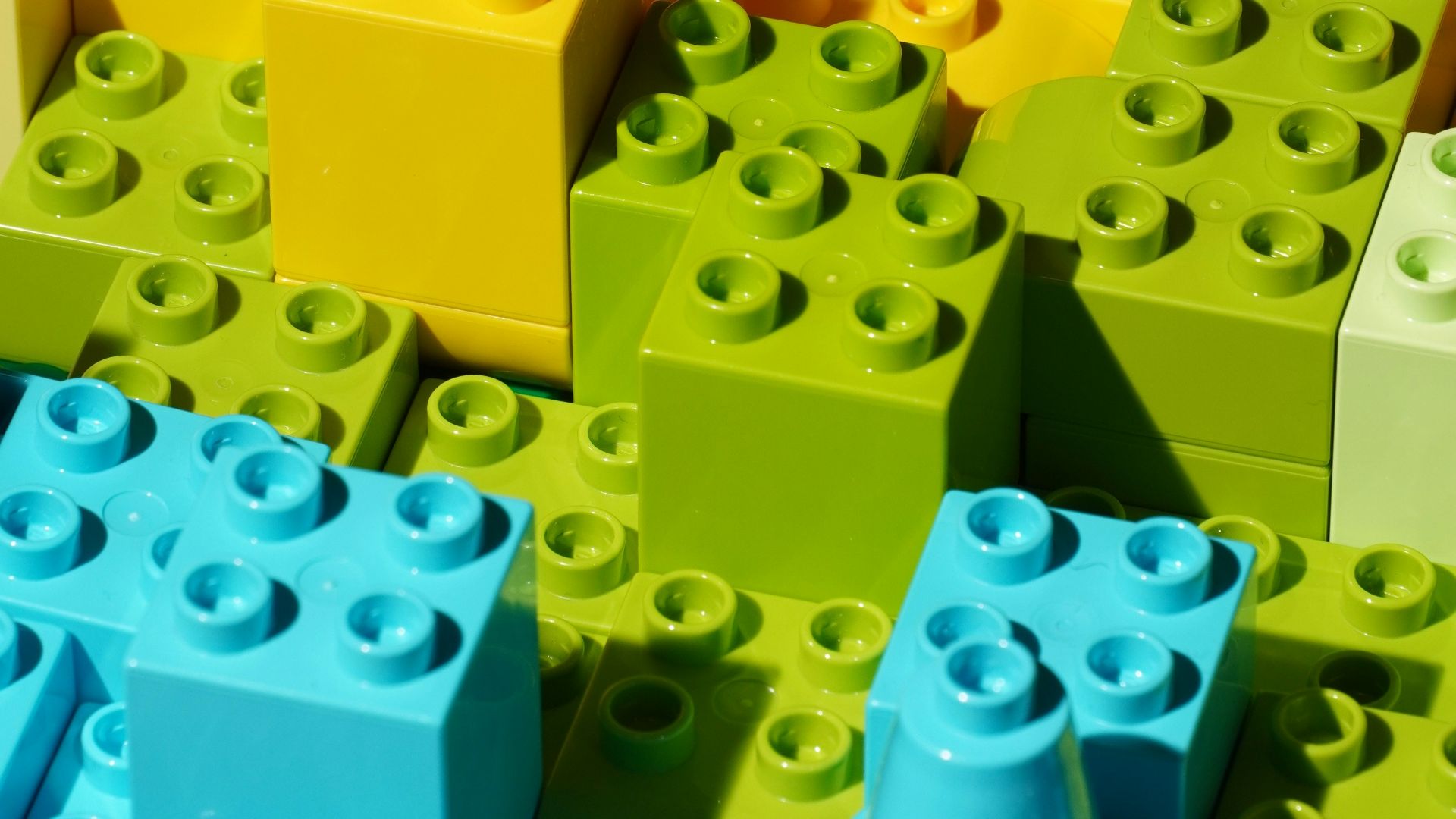 a close up of many different colored legos