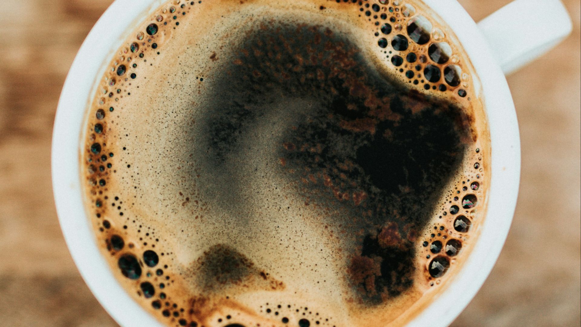 white ceramic mug filled with coffee