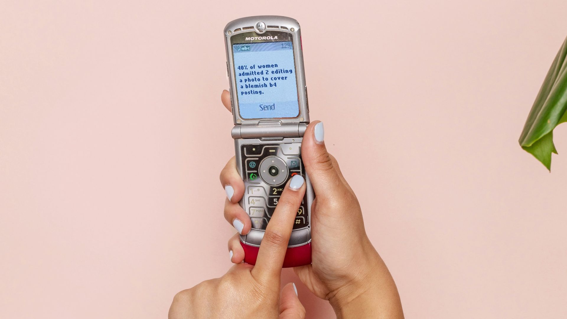turned-on silver flip phone
