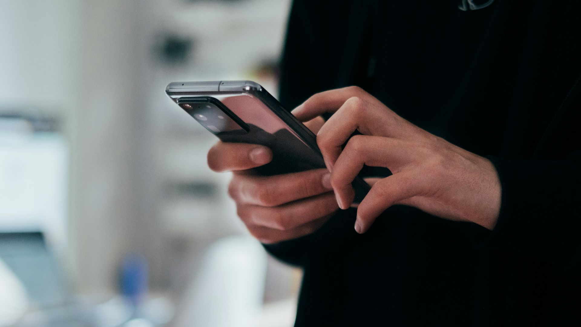 person holding black android smartphone