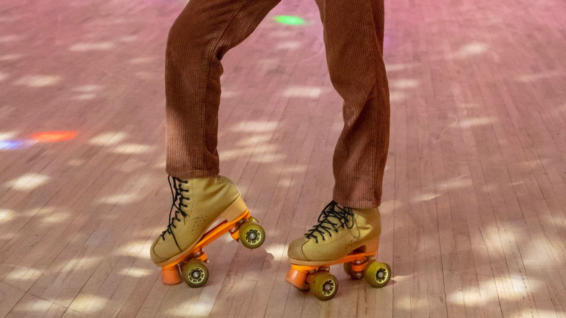 standing woman using roller skates inside building