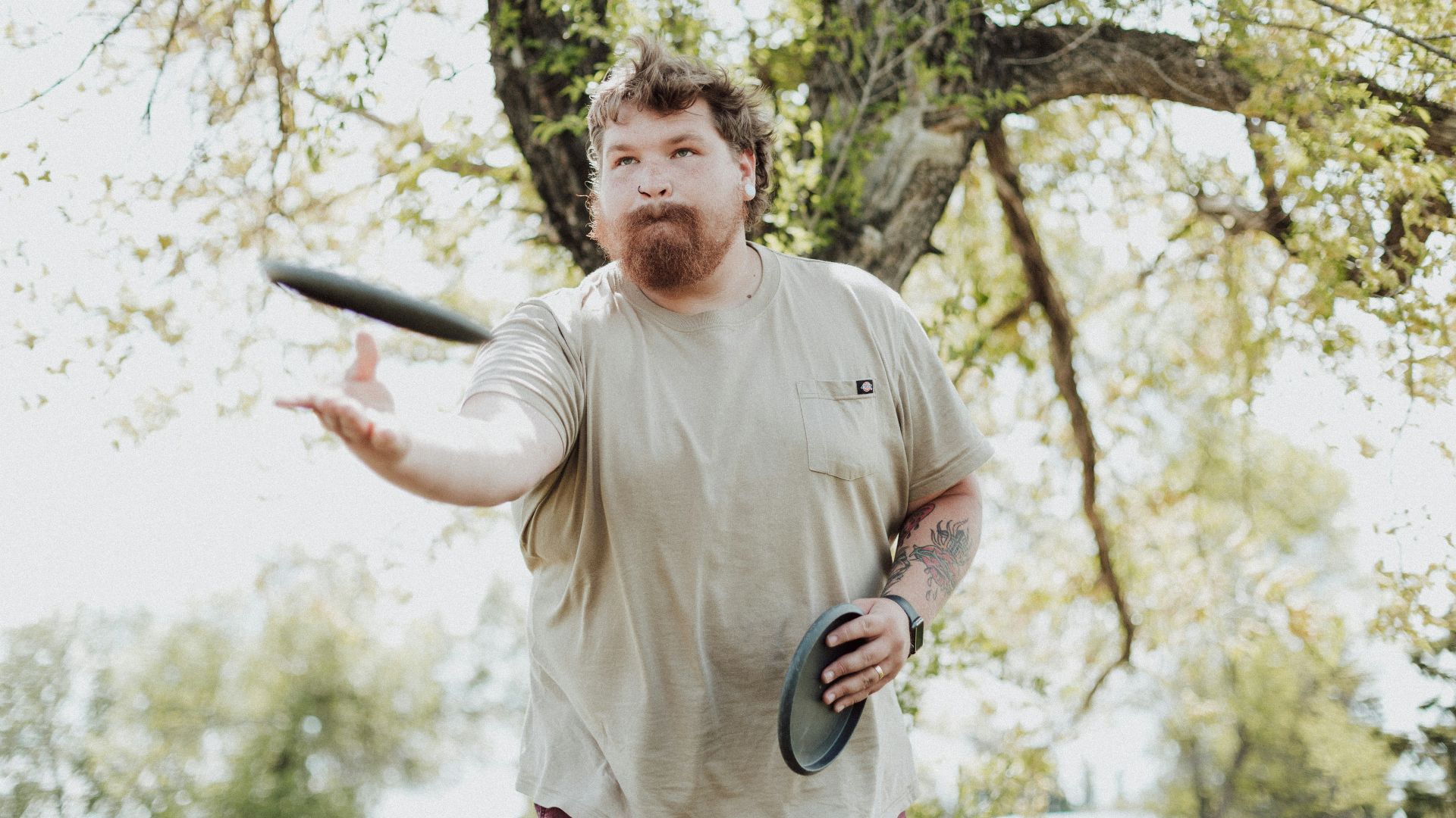 a man holding a frisbee
