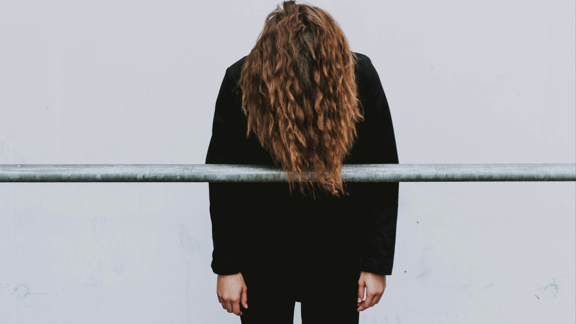 woman wearing black long-sleeved dress