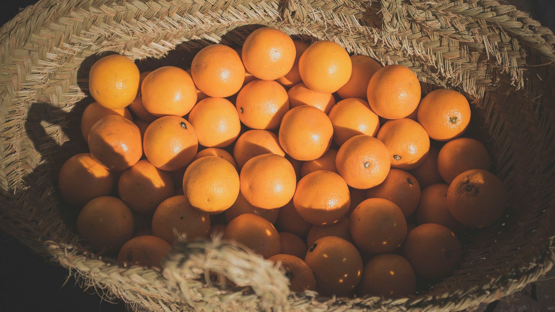 orange fruits on basket
