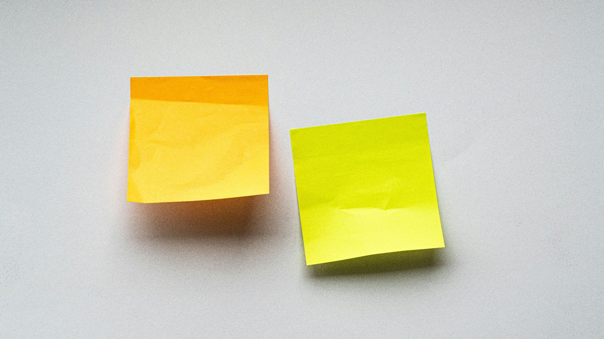 yellow sticky notes on white wall