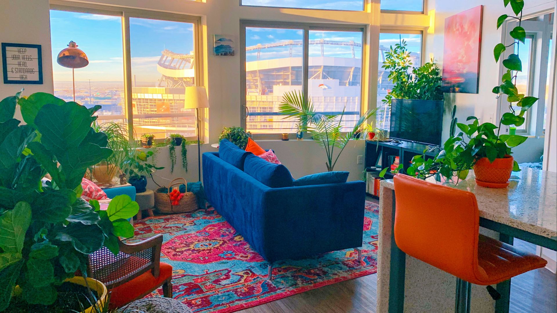 a living room filled with furniture and lots of windows