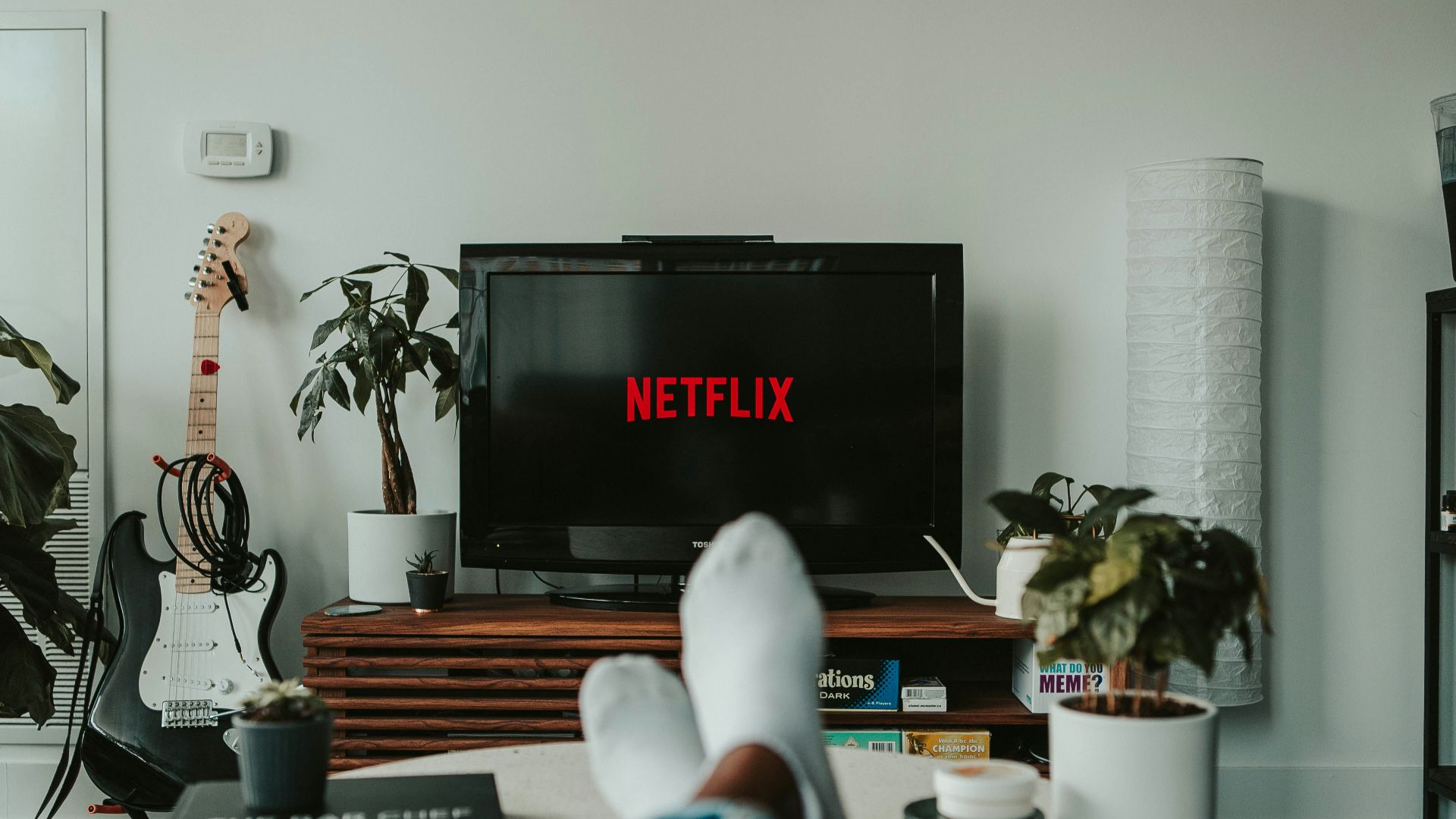 black flat screen tv turned on displaying 11