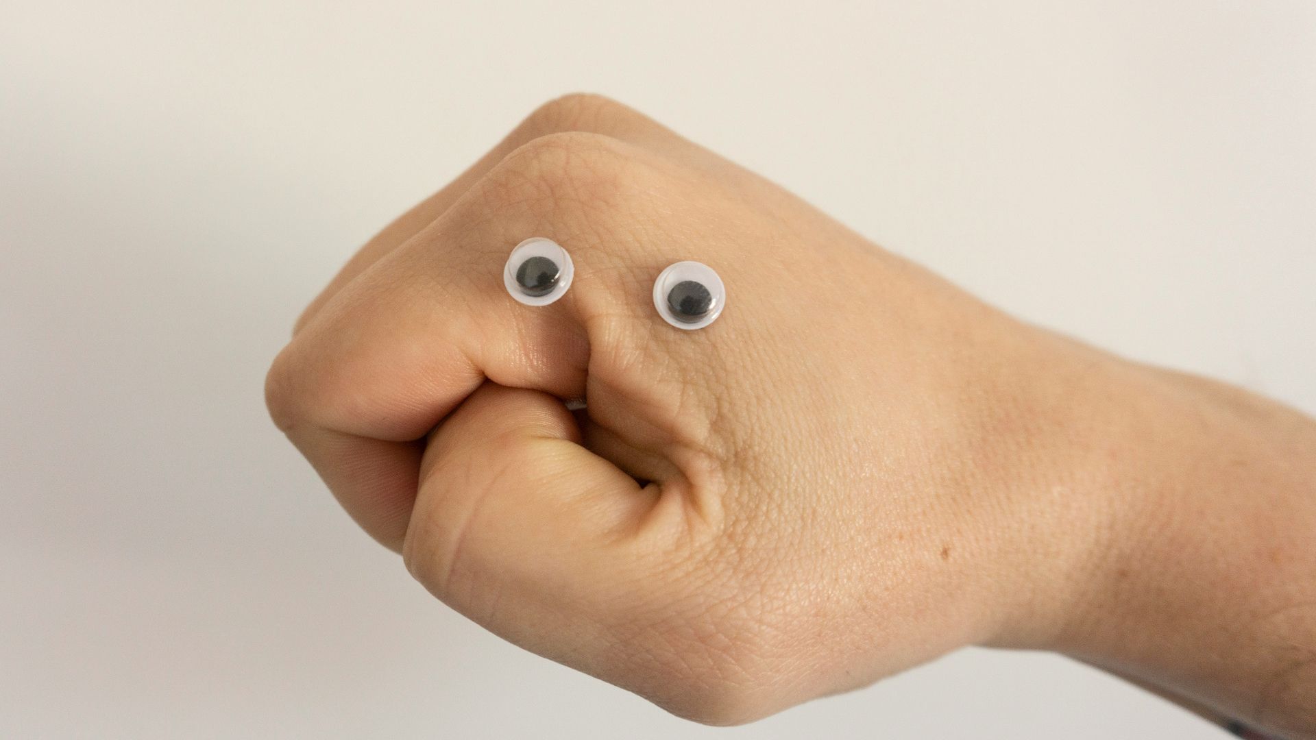 person holding brown heart shaped bread