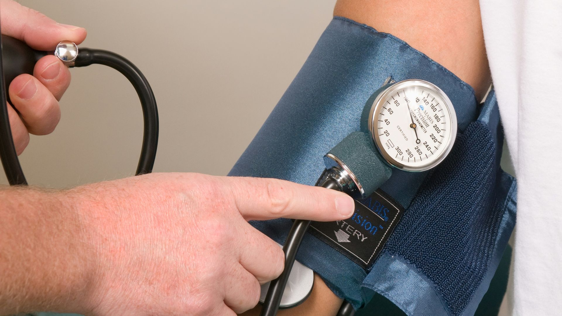 a doctor checking the blood pressure of a patient