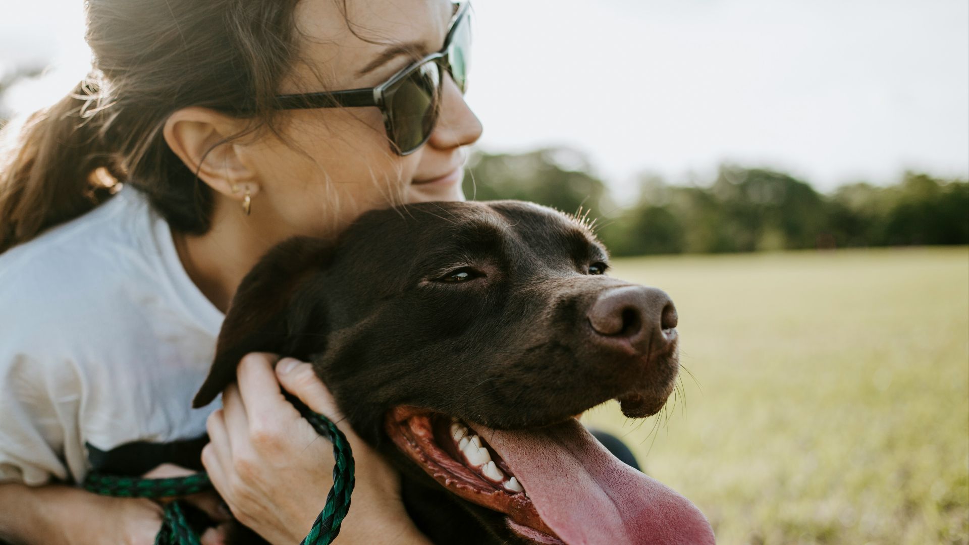 woman hugging a dog